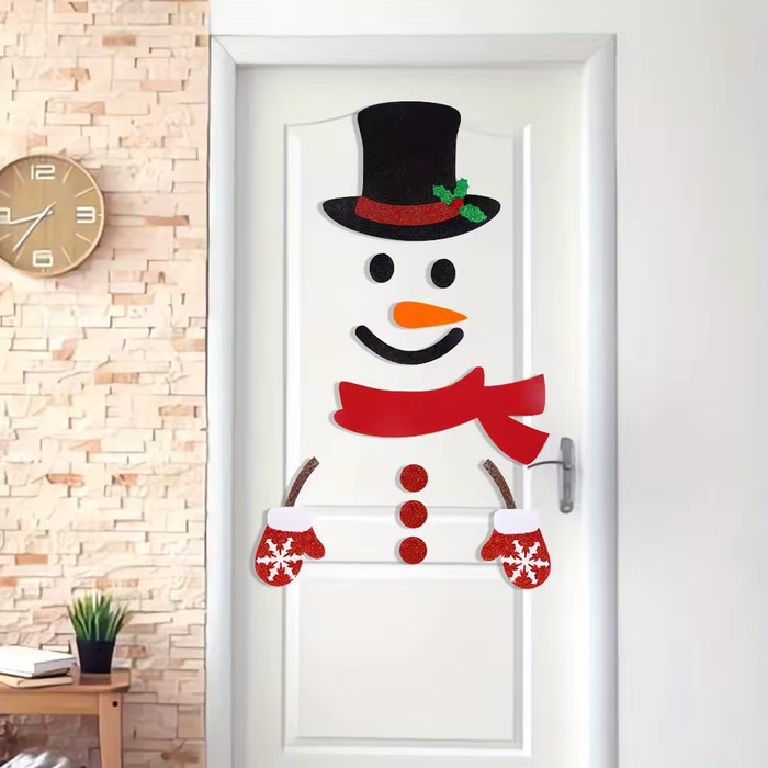 Snowman decorations displayed on a white door; door not included