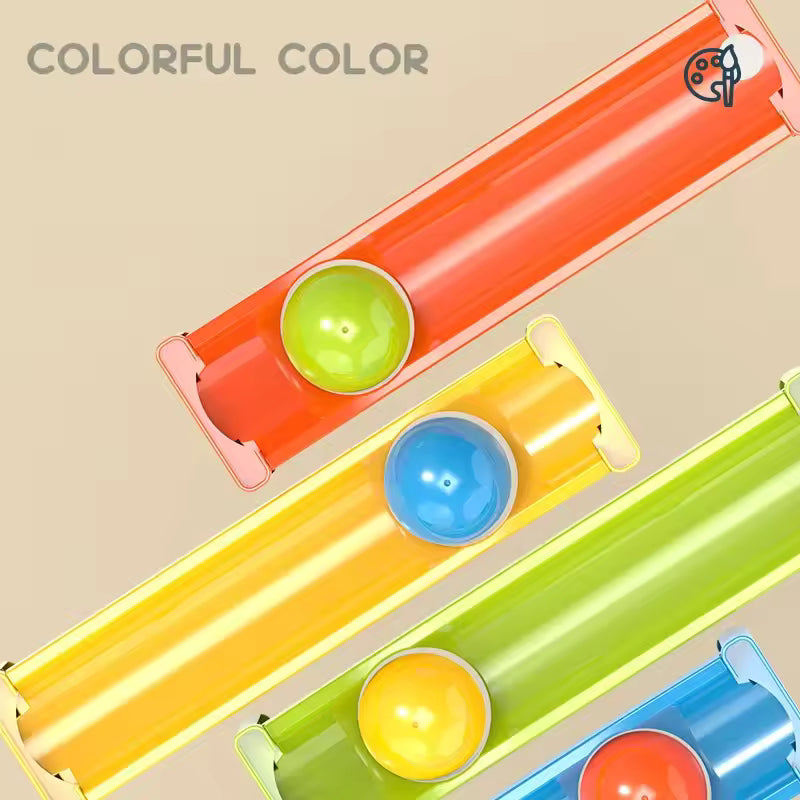 Close-up of colored ramps and rolling balls from the supplier track